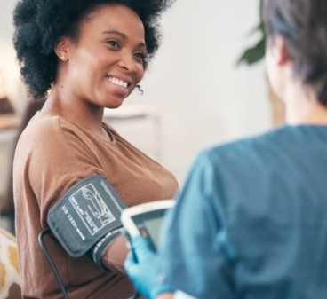 Photo of a person getting their blood pressure checked